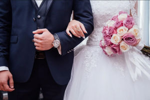 bride and groom with arms linked